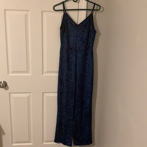 Crushed deep blue velvet jumpsuit, long pants, v neck and deep v crossover back.